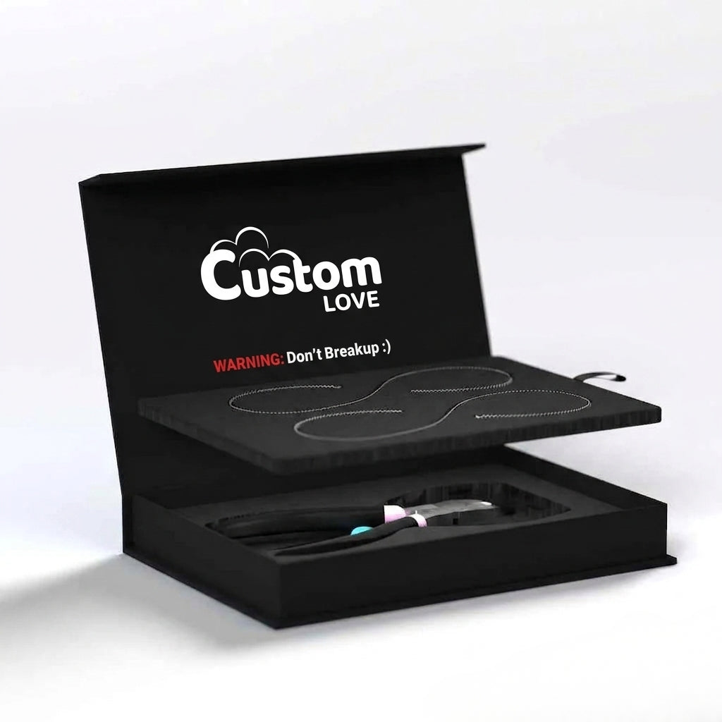 A black presentation box shown open on a light gray background. The lid has the words 'Custom LOVE' in white, with a small red warning note reading 'WARNING: Don't Breakup :)'.