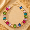 Necklace with colorful gemstones on a beige fabric background